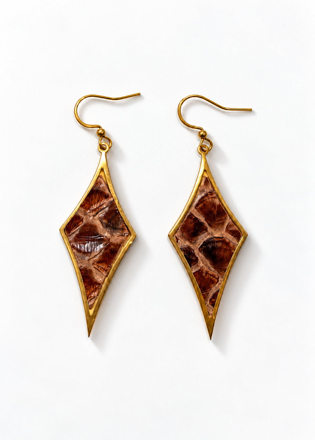 After Hours brown python gold earrings with a subtle shadow on white