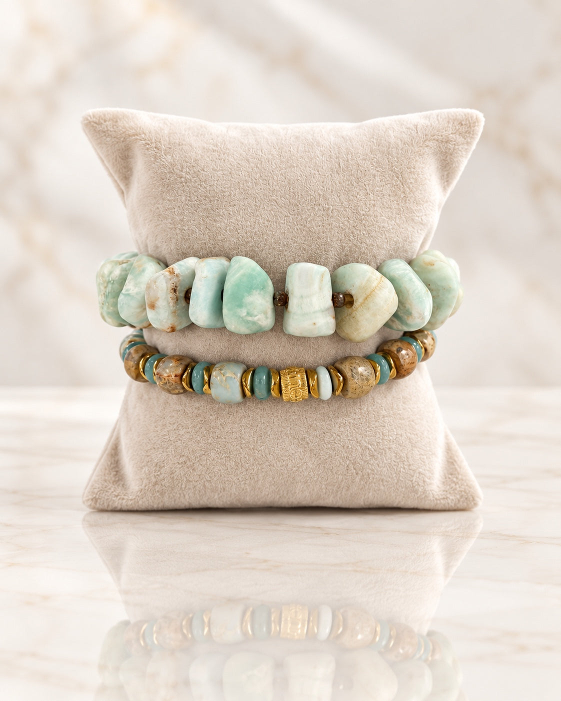 Calm Before the Storm two-bracelet set on a beige pillow