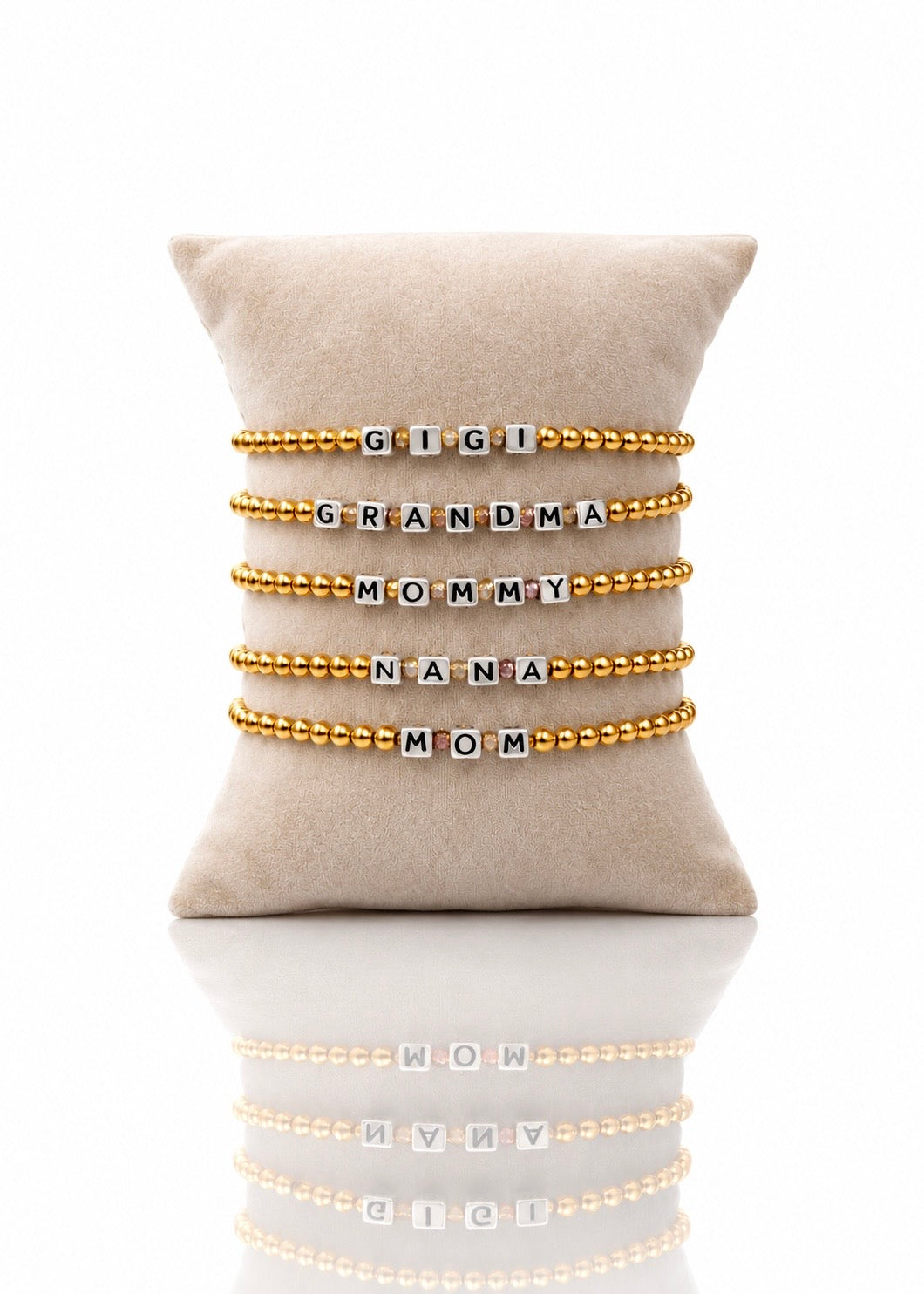 Custom Name Block Letters bracelets on a beige velvet pillow