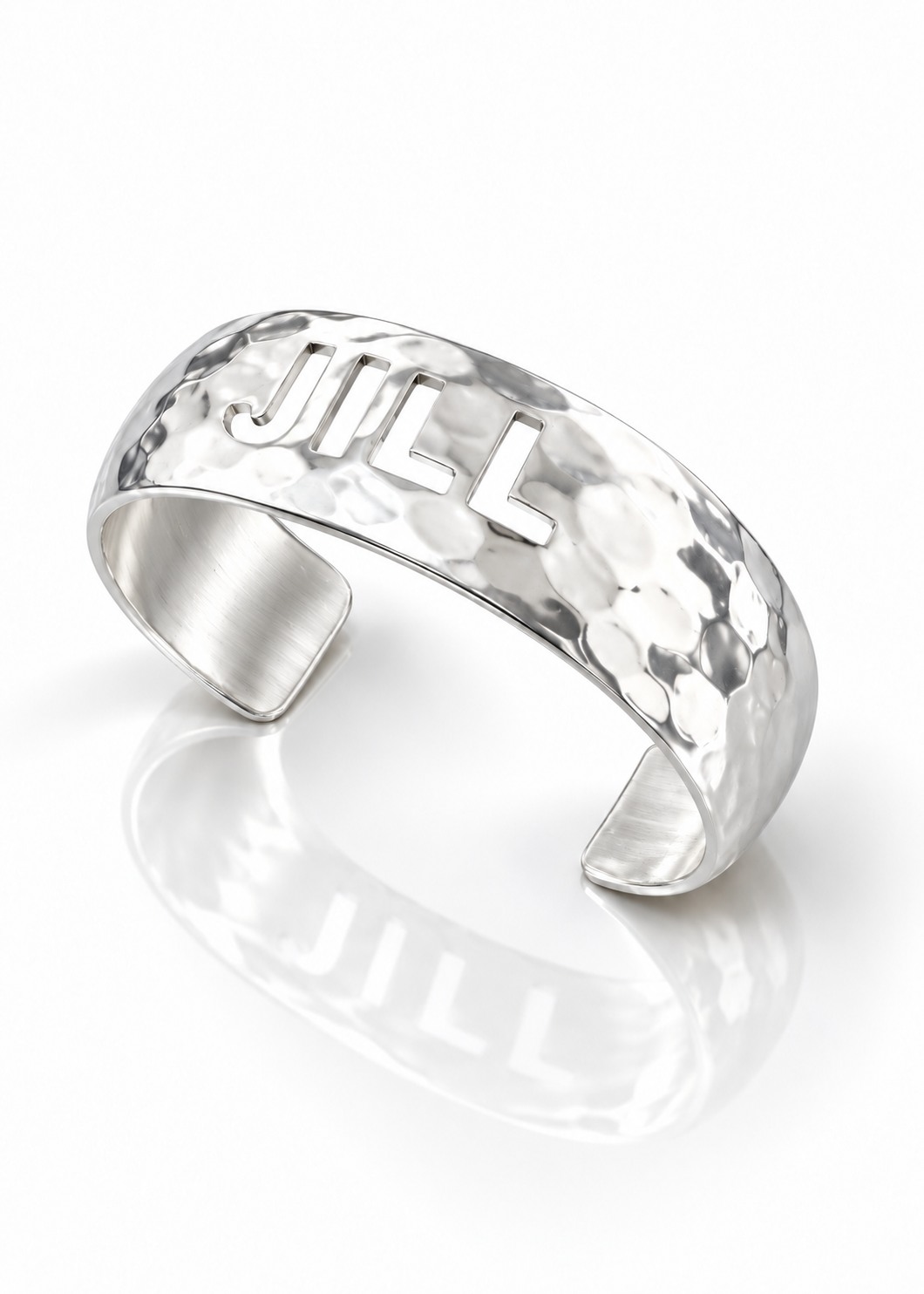 Domed silver cut-out name cuff, angled view