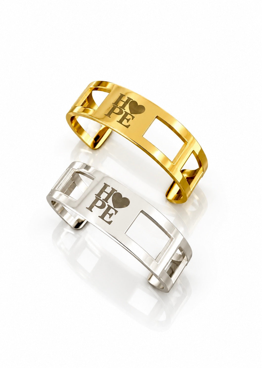Gold and silver Hope cuffs with engraved heart detail, each sold separately