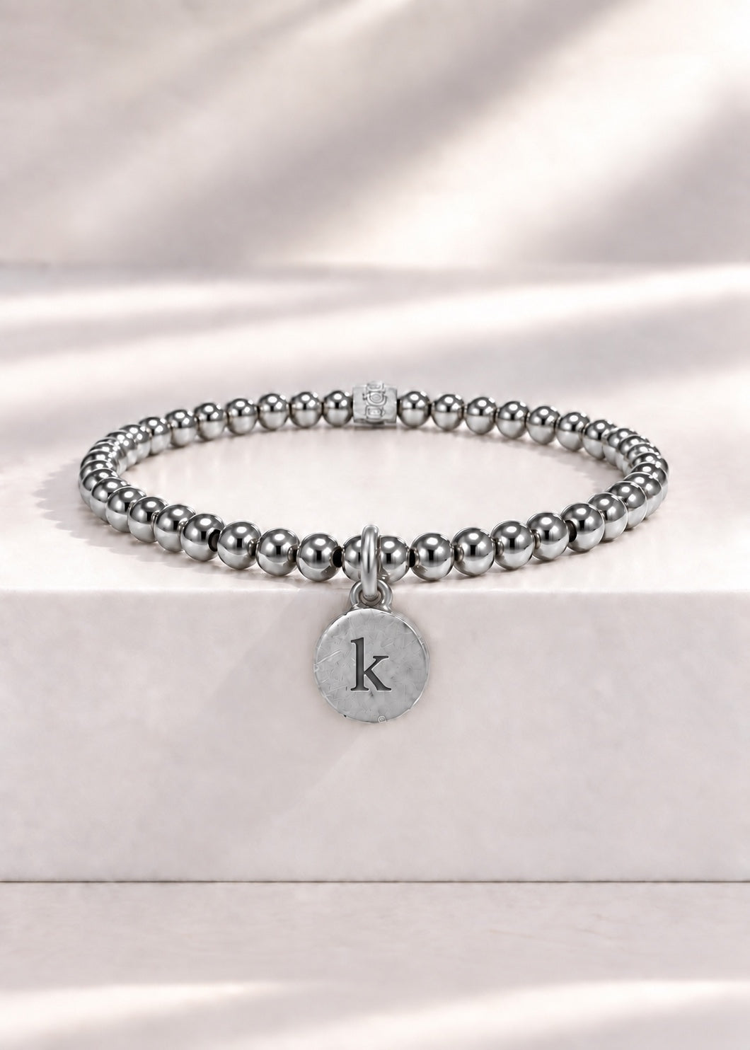 Silver stainless steel beaded bracelet with K initial pendant