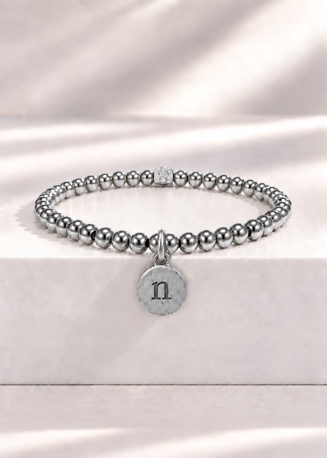 Silver stainless steel beaded bracelet with N initial pendant