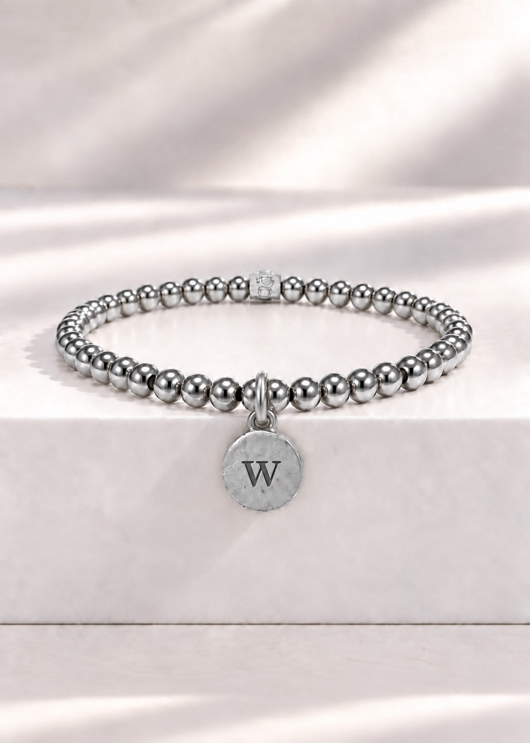 Silver stainless steel beaded bracelet with W initial pendant