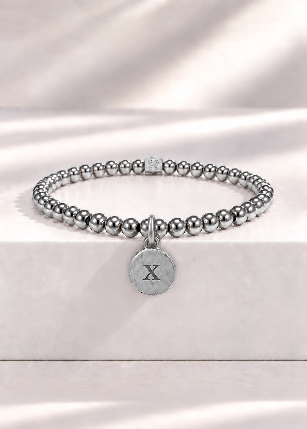 Silver stainless steel beaded bracelet with X initial pendant