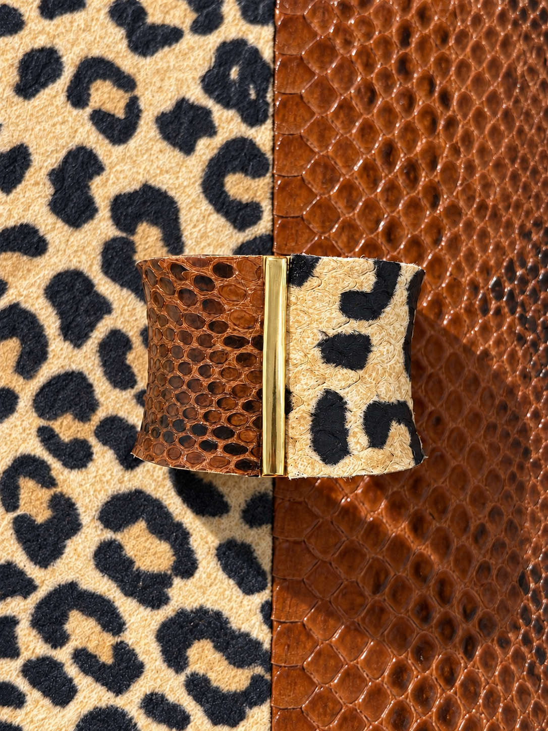Spot On cuff styled on leopard and brown python backgrounds