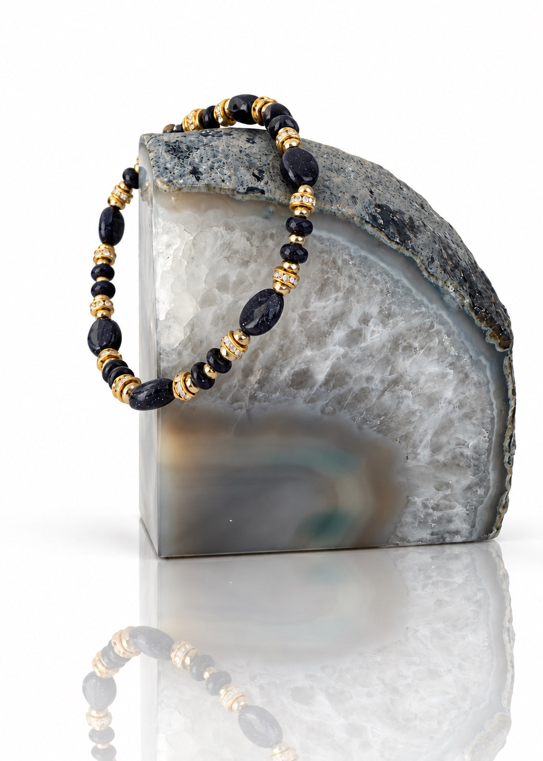 Woodland Blue - Night Sky bracelet displayed on an agate bookend