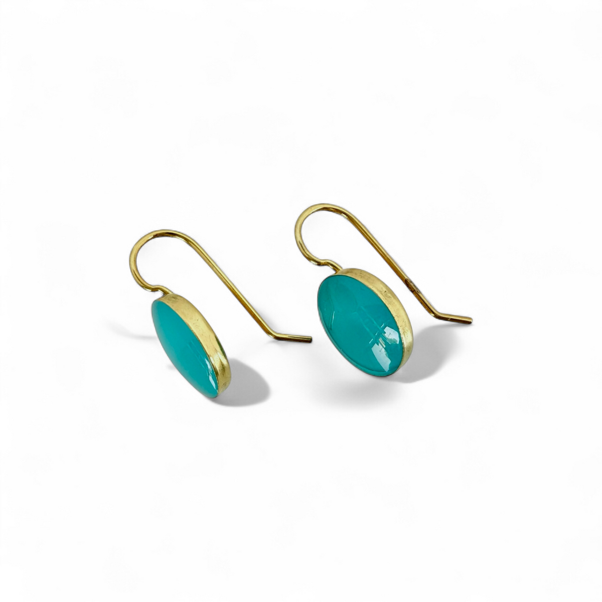 Deep aqua round drop earrings showing gold-tone hooks and side profile