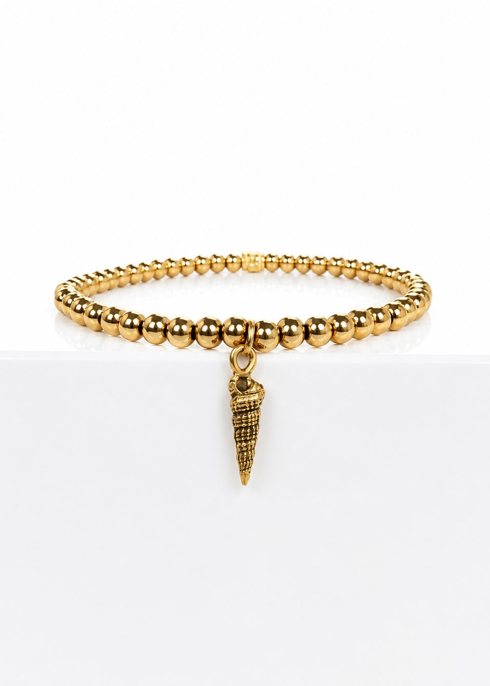 Gold 4mm Chloe Ann Spiral Shell Charm, front view