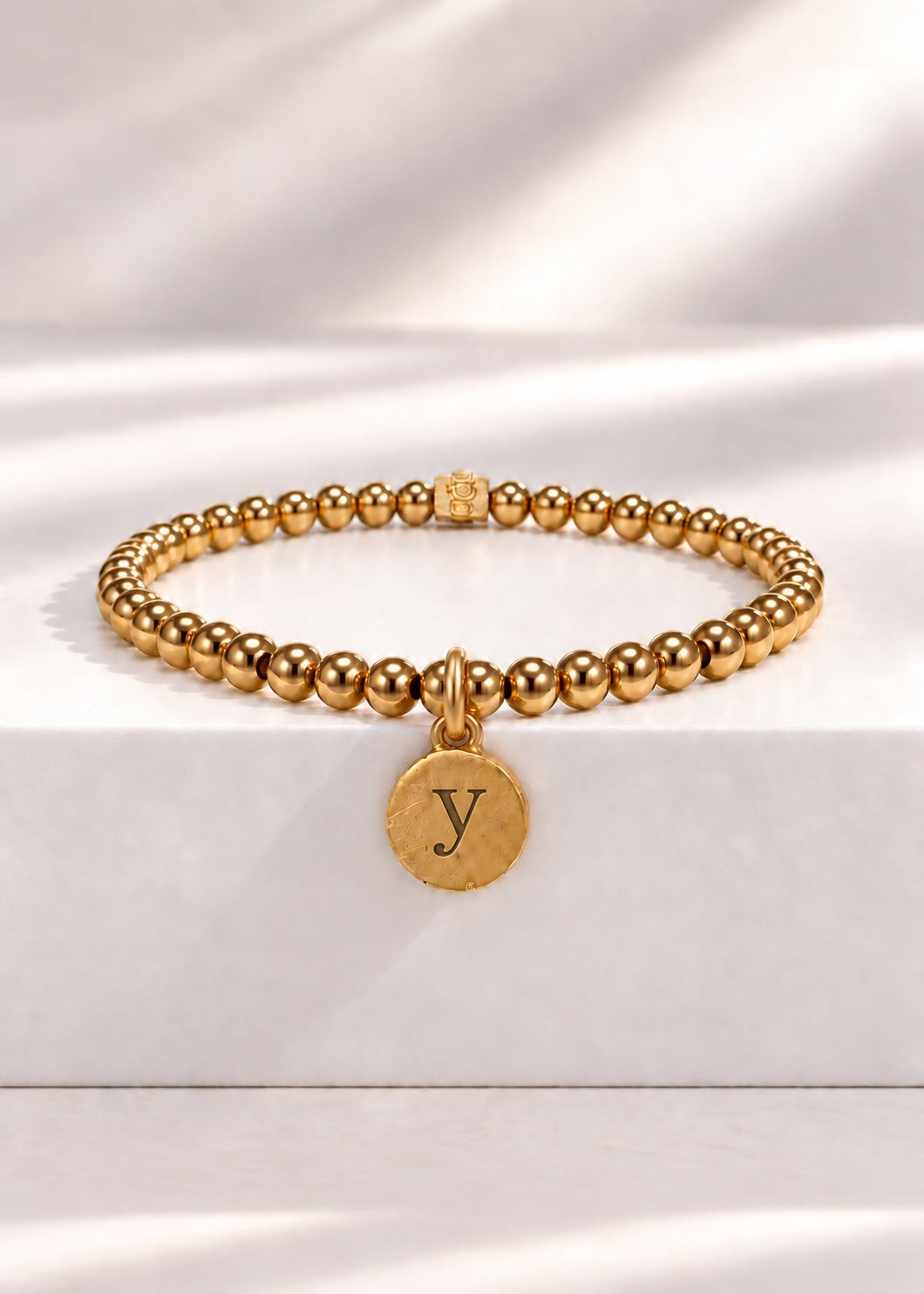 Gold stainless steel beaded bracelet with Y initial pendant
