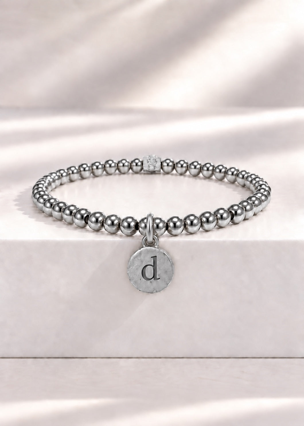 Silver stainless steel beaded bracelet with D initial pendant