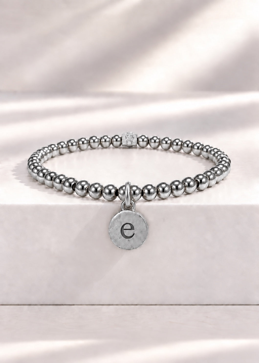 Silver stainless steel beaded bracelet with E initial pendant