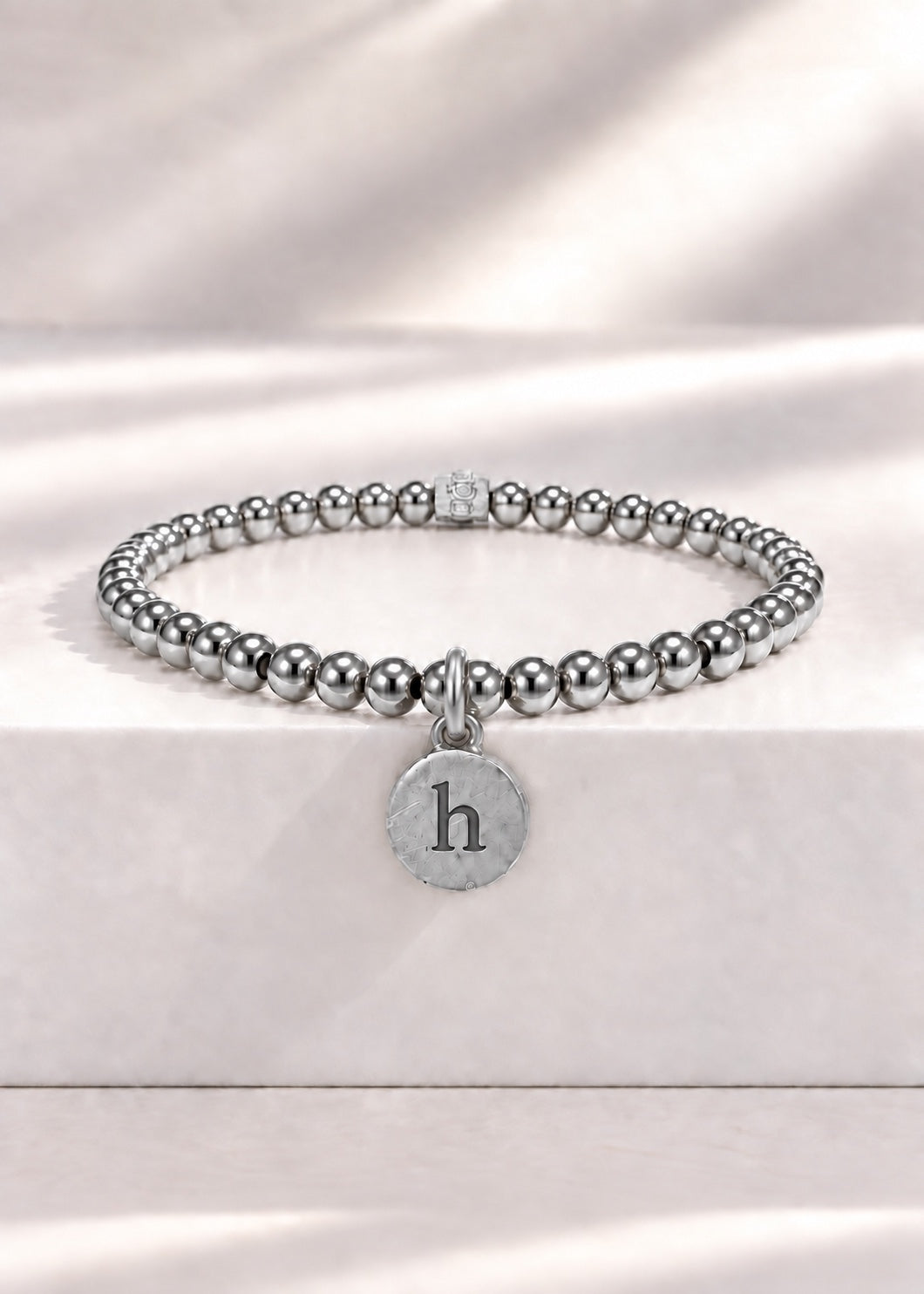 Silver stainless steel beaded bracelet with H initial pendant