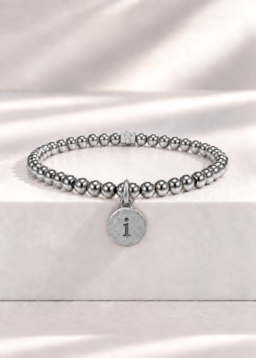 Silver stainless steel beaded bracelet with I initial pendant