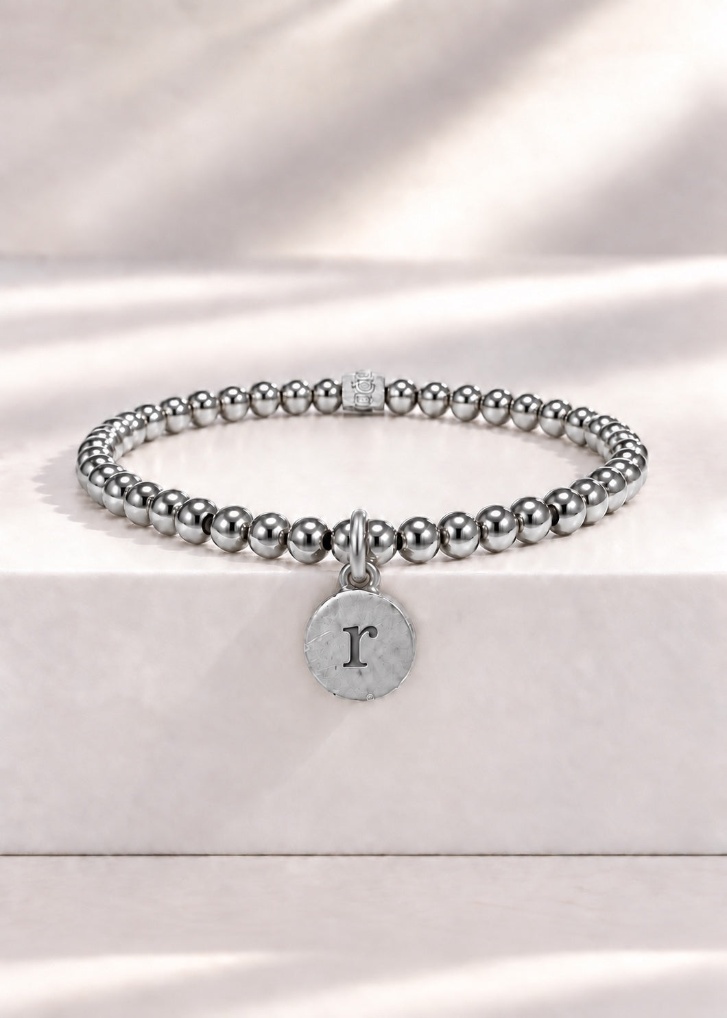 Silver stainless steel beaded bracelet with R initial pendant
