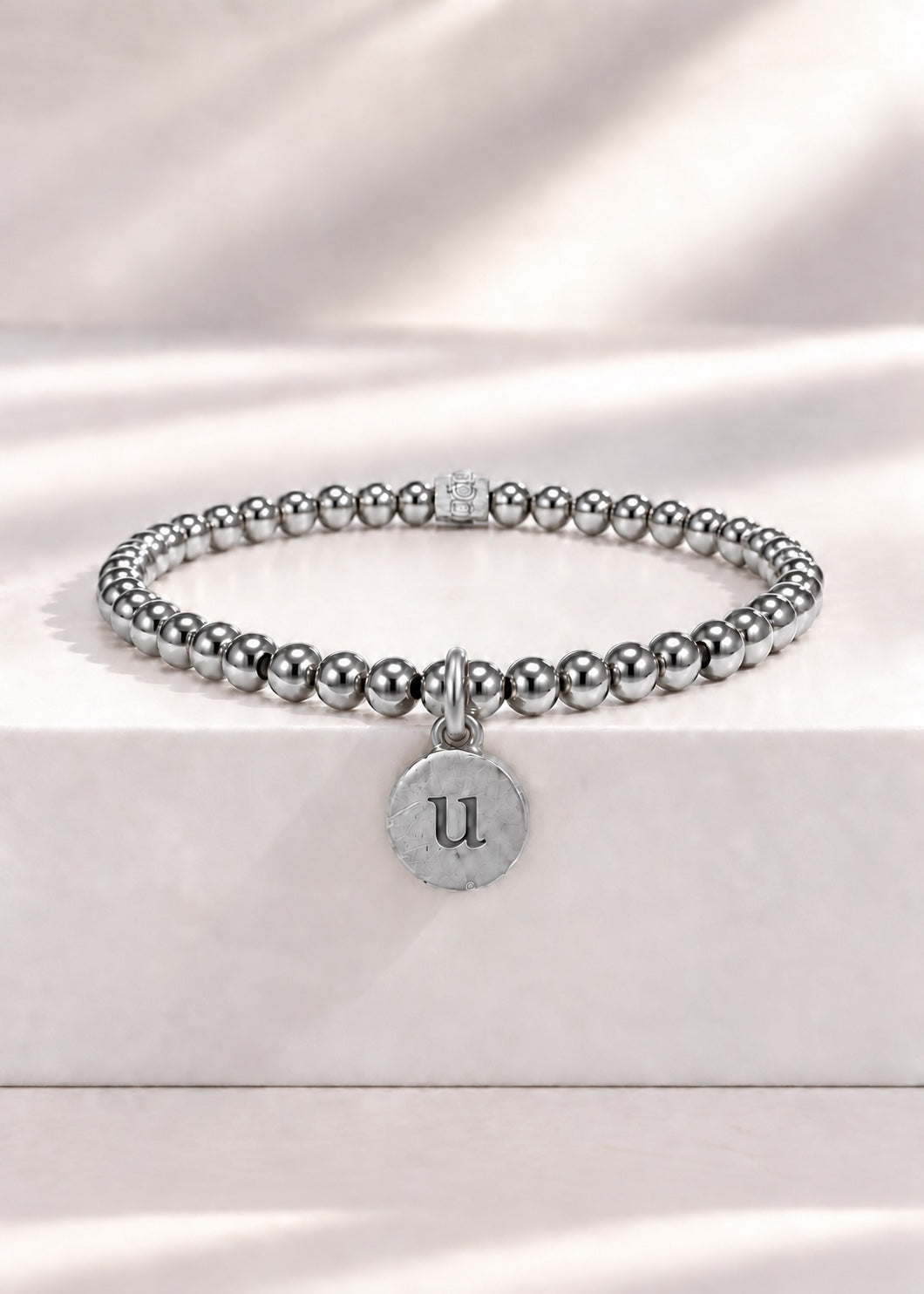 Silver stainless steel beaded bracelet with U initial pendant