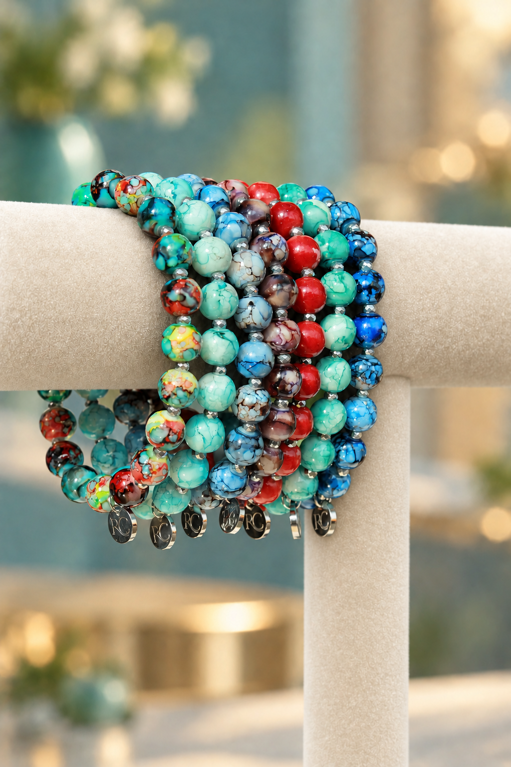 Jasper Lane bracelets in seven colors on a cream display